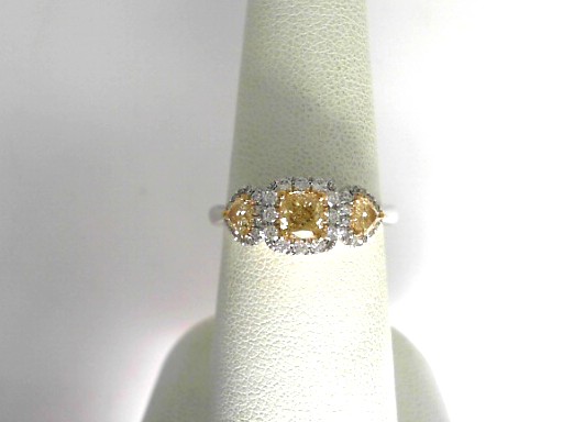 18 Karat Yellow And White Gold Halo Engagement Ring Center Fancy Yellow Cushion Cut Diamond And Two Fancy Yellow Heart Shape Diamonds 0.73 Tw
Ring Size : 6.5