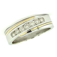 14 Karat Yellow/White Gold Channel Set Wedding 6.5mm Band With 7=0.47Tw Round Diamonds 
Ring Size: 10.5