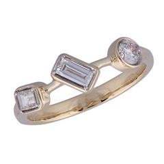 14 Karat Yellow Gold 3 Stone Station Fashion Ring With 2=0.40Tw Baguette Diamonds And One 0.18Ct Round  Diamond 
Ring Size: 7.5
