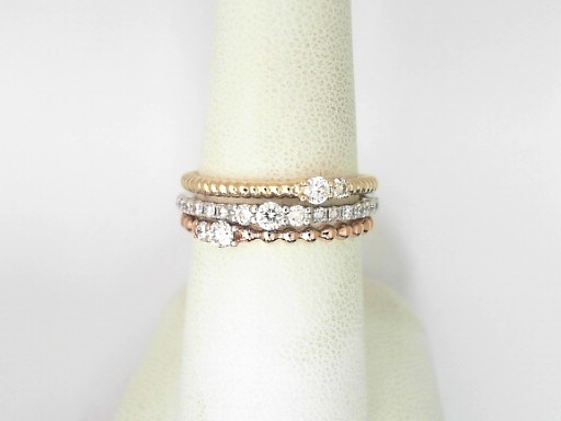 14 Karat Two Tone Gold And Platinum Round Brilliant Cut Diamond Three Row Ring 0.48 Cts
Ring Size : 7