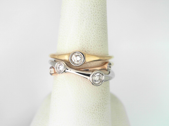 14 Karat Two Tone Gold And Platinum Round Brilliant Cut Diamond Bezel Set Ring 0.26 Cts
Ring Size: 7