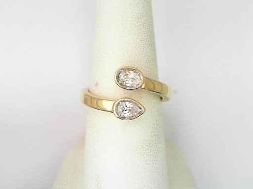 14 Karat Yellow Gold Oval Brilliant And Pear Shaped Diamond Bypass Ring 0.38 Cts
Ring Size: 7.5
