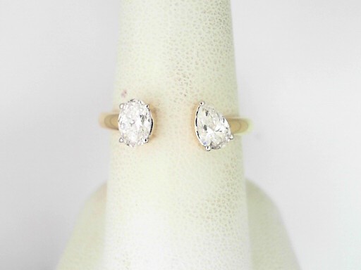 14 Karat Yellow Gold Oval and Pear Shaped Diamond Bypass Ring 0.72 Cts 
Ring Size: 7.5