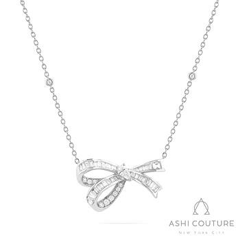 18 Karat White Gold Couture 1.00 ct Pear, Baguette And Round Brilliant Cut Diamond Bow Station Necklace
18 inch