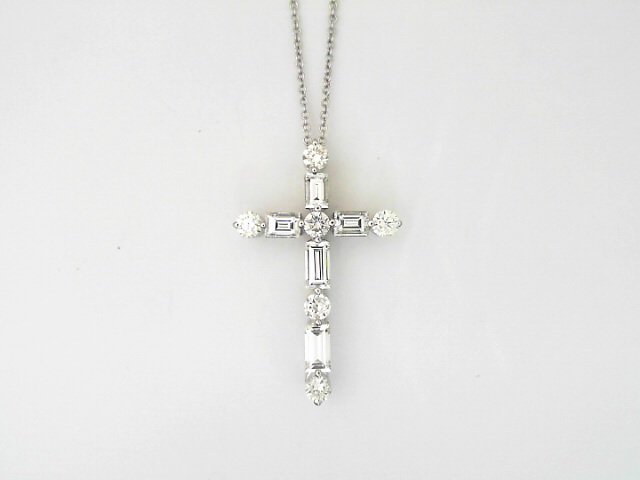 Platinum Round Brilliant Cut and Bagette Cut Diamond Shared Prong Cross 0.63 ct 
Length: 18 Inch 14 kt white gold chain
