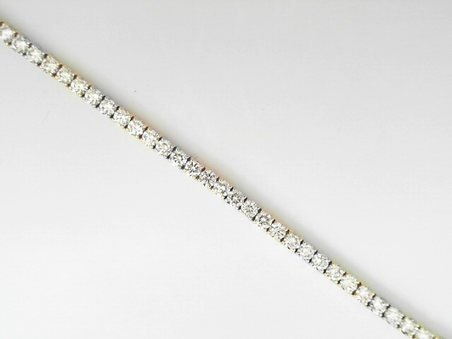 14 Karat Yellow And White Round Brilliant Cut Diamond Line Bracelet 4.94 Cts 
Length/Size: 7 Inch