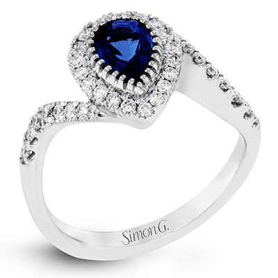 Simon G 18 Karat White Gold Halo Ring With  One Pear Sapphire At 0.85Ct And
Round Diamonds At  0.37Tw