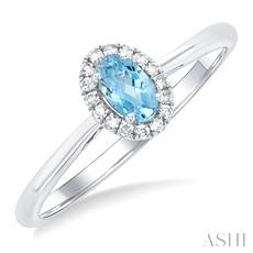 10 Karat White Gold 5 X 3 Oval Aquamarine And 0.07 ct Diamond Halo Ring