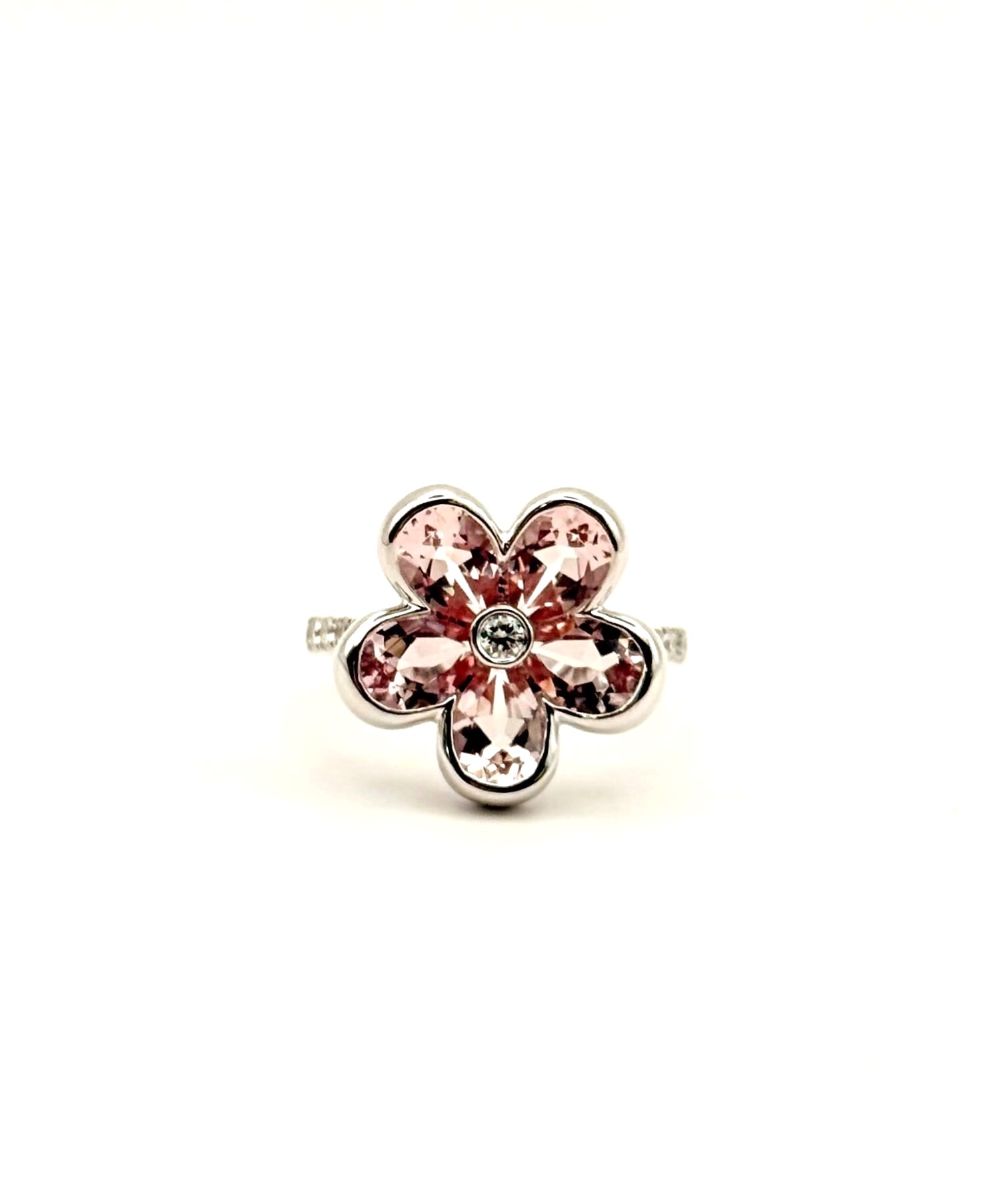 Charles Krypel 18 Karat White Gold Flower Fashion Ring With 13=0.32Tw Round F/G Vs Diamonds And 5=2.85Tw Pear Morganites 
Ring Size: 6.5