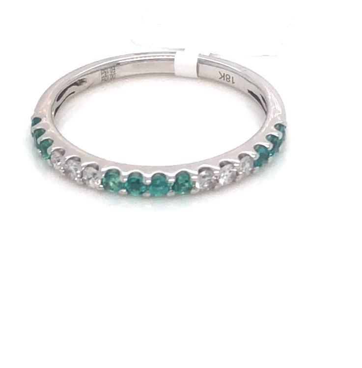 18 Karat White Gold Band With 10=0.15Tw Round Emeralds And 6=0.12Tw Round Diamonds 
Ring Size: 6.5
