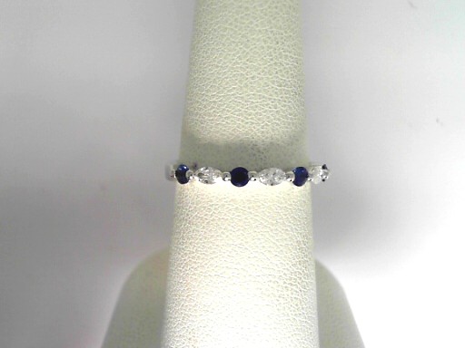 14 Karat White Gold  Fashion Ring With 3=0.19Tw Marquise Diamonds And 4=0.25Tw Round Sapphires 
Ring Size: 6.5