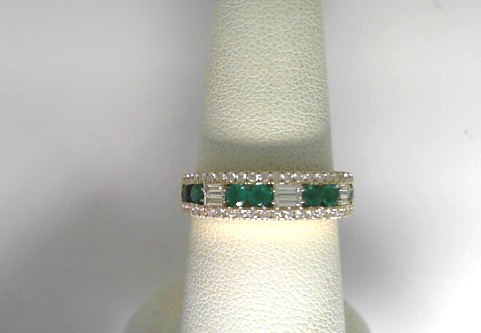 14 Karat Yellow Gold Fashion Ring With 8=0.49Tw Round Emeralds and 6=0.19Tw Baguette Diamonds
Ring Size: 6.5