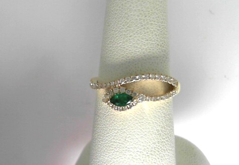 14 Karat Yellow Gold Fashion Ring With One 0.12Ct Marquise Emerald And 41=0.30Tw Round Diamonds
Ring Size: 6.5