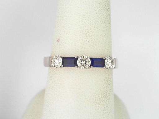 Platinum 0.36 Cts Round Brilliant Cut Diamond And 0.32 Cts Bagguette Cut Sapphire Ring 
Ring Size: 7.5