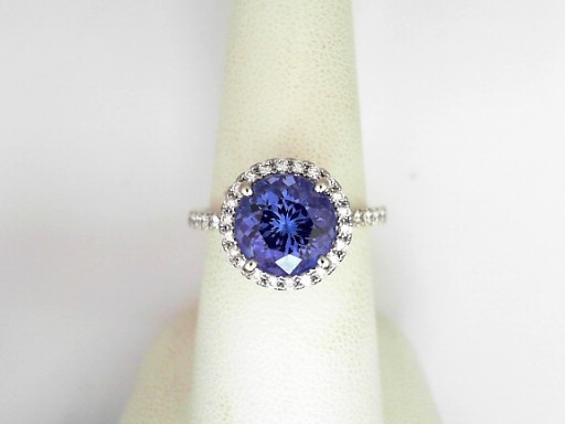 Platinum Roung Shaped Tanzanite 3.22 Cts And Round Brilliant Cut Diamond 0.40 Cts Halo Ring 
Ring Size: 7