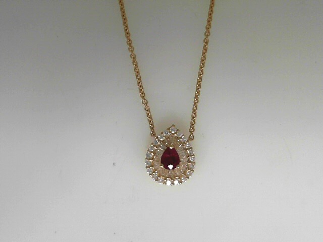 18 Karat Yellow Gold Pendant With One 0.48Ct Pear Ruby, 22=0.27Tw Baguette G/H VS-SI Diamonds And 0.25 Twt Other Stones
 Length: 17