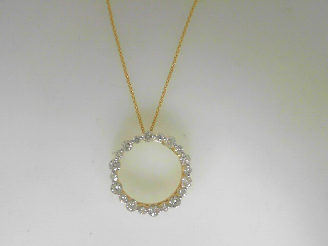 14 Karat Yellow Gold Circle Pendant With 20=0.79Tw Round Diamonds 
Length: 18