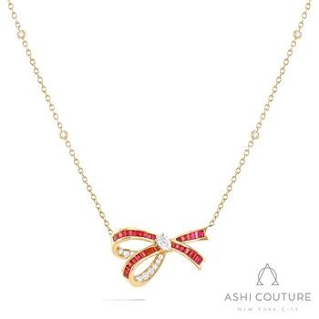 18 Karat Yellow Gold Couture Ruby And Diamond bow and bezel set station necklace 
18 inch