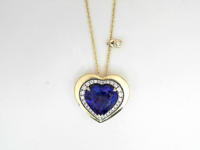 14 Karat Yellow Gold And Platinum 5.74 Cts Heart Shaped Tanzanite And 0.30 Cts Round Brilliant Cut Diamond Heart Shaped Pendant 
Length: 18 Inch