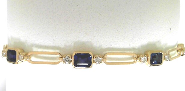 14 Karat Yellow Gold Station Link Bracelet With 9=4.42Tw Emerald Cut Sapphires And 16= Round H/I SI1-2 Diamonds 0.46ctw
Length: 7