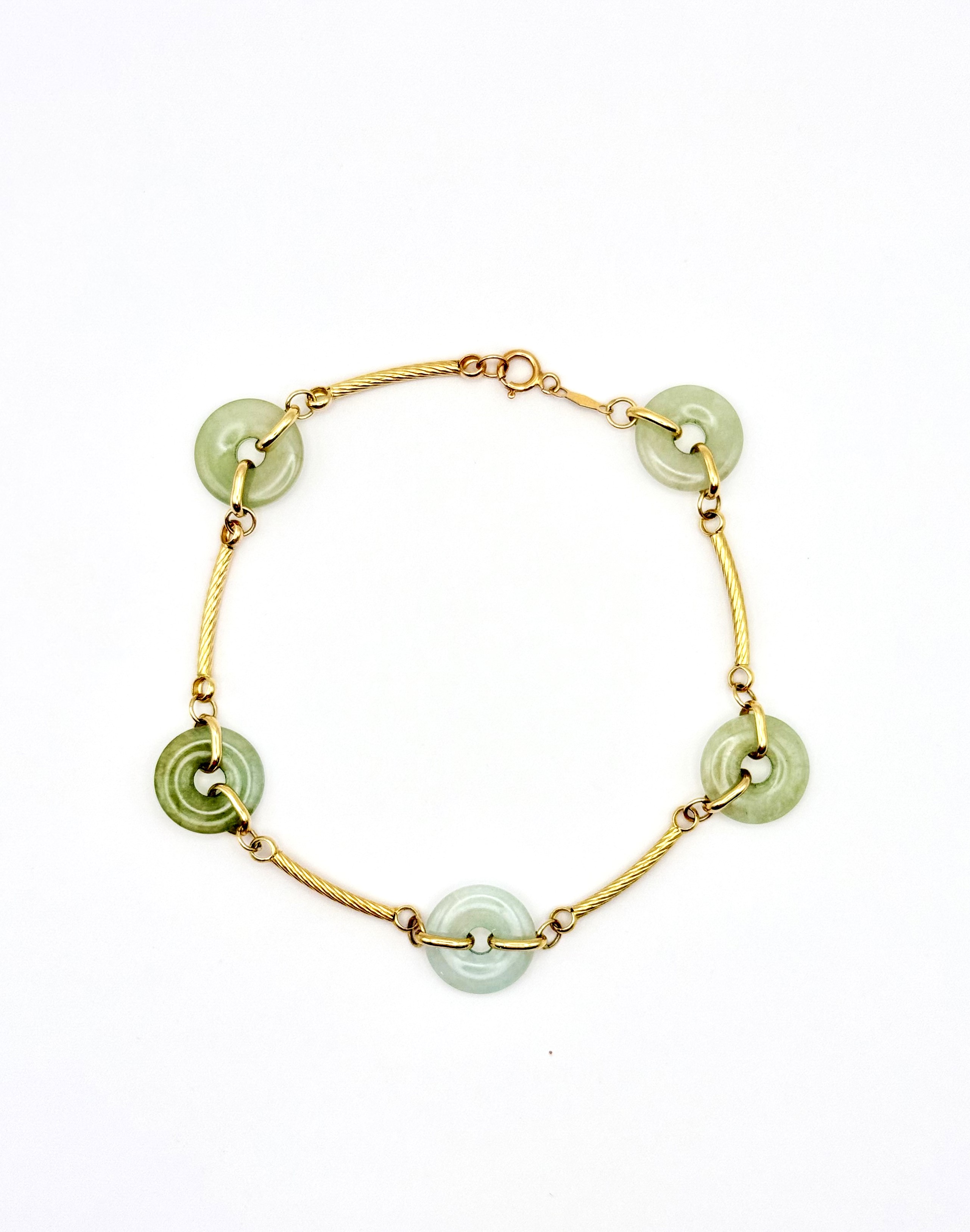 Estate 14 Karat Yellow Gold Jade Donut station bracelet 
Length: 8