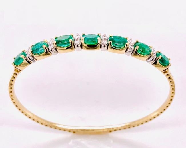 14 Karat Yellow Gold Flexible Bangle Bracelet With 7=3.03Tw Oval Emeralds And 12=0.35Tw Round Diamonds