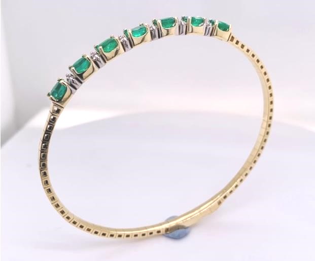 14 Karat Yellow/White Flexible Bangle Bracelet With 7=2.27Tw Oval Emeralds And 12=0.21Tw Round  Diamonds