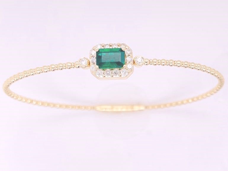 14 Karat Yellow Gold Flexible Bangle Bracelet With One 0.70Ct Emerald Cut Emerald And 16=0.41Tw Round Diamonds