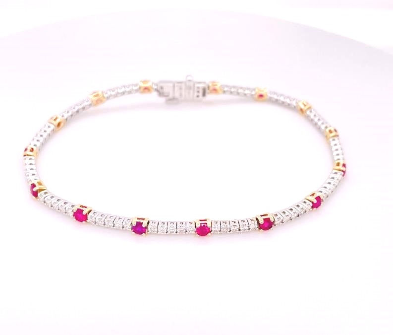 14 Karat Yellow Gold Tennis Bracelet With 16=1.50Tw Round Rubys And 76=1.32Tw Round Diamonds
Length: 7