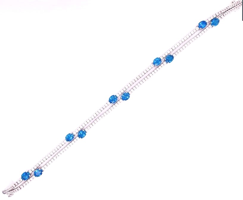14 Karat Yellow/White Double Row Tennis Bracelet With 10=4.26Tw Oval Sapphires And 2.56Tw Round Diamonds
Sapphires Set In Yellow Gold
Length: 7