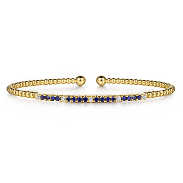 Gabriel & Co 14 Karat Yellow Gold Bujukan Bar Diamond and Blue Sapphire Split Bangle Size 6
Sapphire 0.36ct  $ Diamond 0.09ct