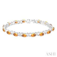 Sterling Silver 7x5 MM Oval Cut Citrine and 0.10 ct Round Cut Diamond Bracelet 
7 inch