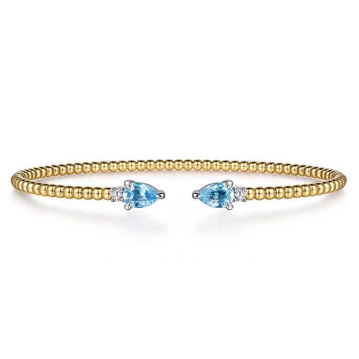 Gabriel & Co 14K White & Yellow Gold Bujukan Open Cuff Bracelet with 0.96 ct Blue Topaz and 0.09 ct Diamond End Caps
Bracelet Size: 6.25