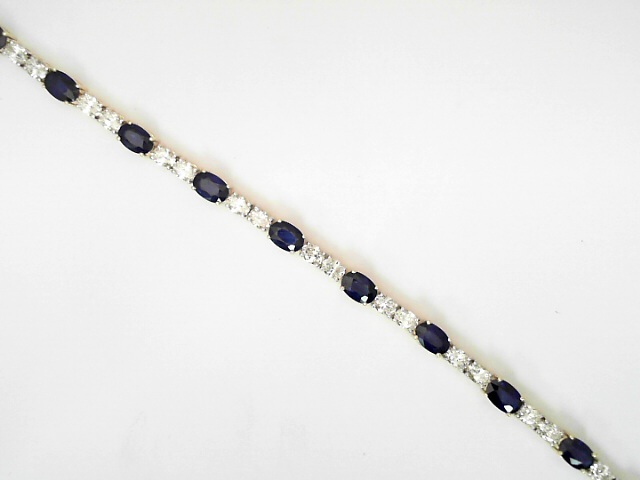 14 Karat Yellow Gold Oval Shaped 3.78 Cts Diamonds And 7.40 Cts Sapphires Line Bracelet
Length / Size : 7.5 Inch