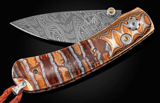 William Henry: Knife
Frame Type:Wave Mokume
Blade Type: 'Hornets Nest' Damascus
Serial: 269-0166
Number:41/100
Gemstones/Embellishments: Citrine