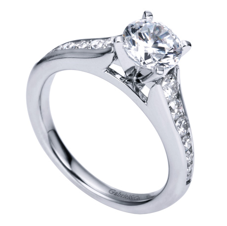 14Kw Tapered Channel Set Semi-Mount D=.49Ctw  14d    Nicola  14k White Gold Round Straight   Engagement Ring  An array of diamonds peek through beautifully curved band  leading to a radiant diamond center stone  in this modern 14K white gold enga