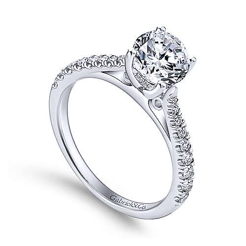 14Kw .28Ct Dia Semi-Mount    A delicately tapered white gold band encrusted with petite round diamonds will support your dazzling center stone in a secure four prong setting.
