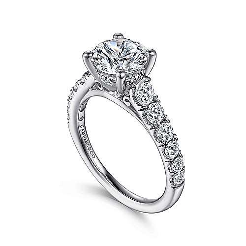 14kw .81ct Dia Semi-Mount    This diamond engagement ring features a four prong setting to keep your precious center stone secure  and a tapered band of brilliant pavé diamonds to accent it perfectly.