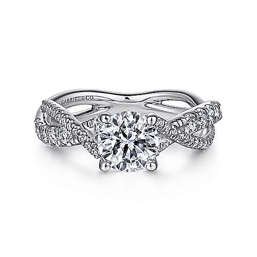 -14kw .36cttw Twist Shank Eng Ring Mounting    This captivating engagement ring features a divided band with 14K white gold ribbons that twist around one another to create a uniquely beautiful design. The shank and gallery beneath the round cut cen