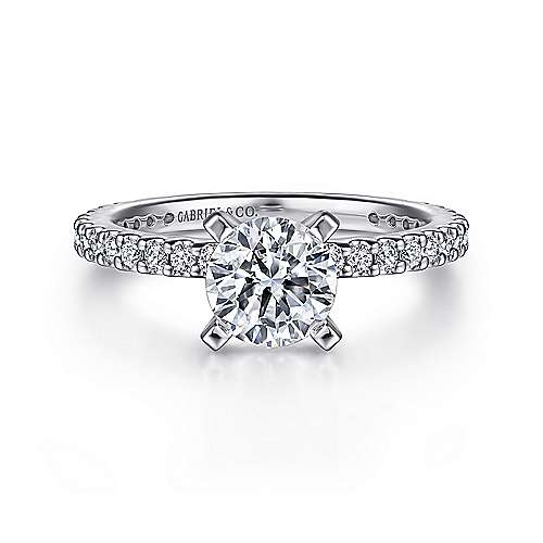 -14kw .36cttw Shared Prong Eng Ring Mounting    A delicate yet elegant engagement ring made for the sophisticated woman. This round center stone sits atop diamond encrusted band that shines at all angles.