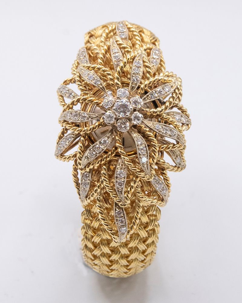 Movado Estate18K Gold  Diamond Petal Hidden Watch.
