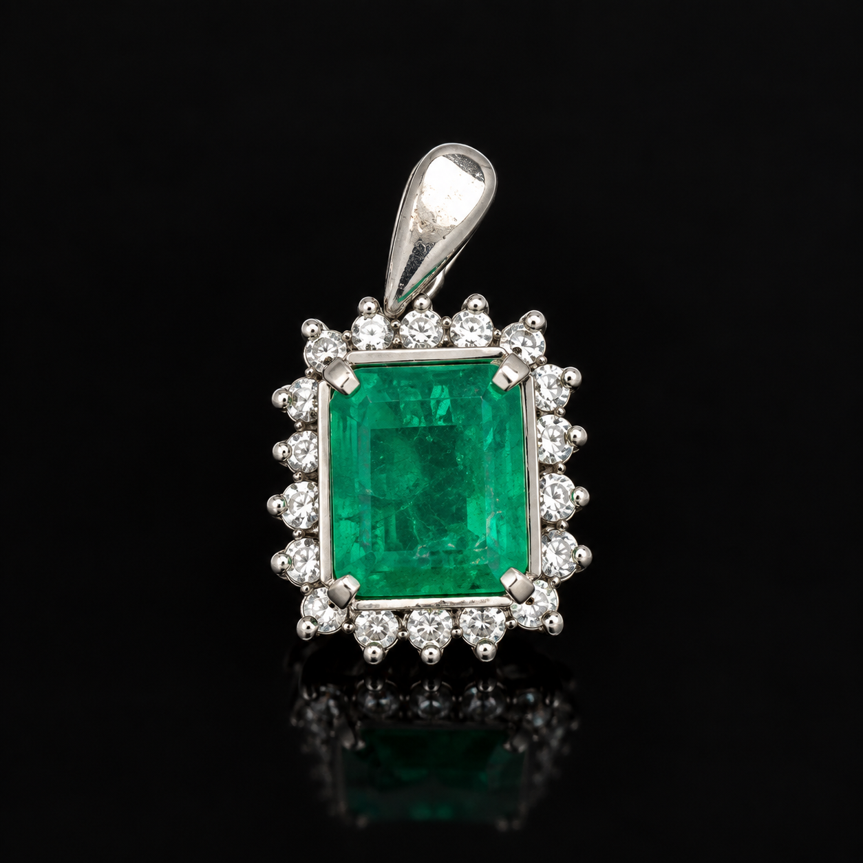 Estate Pendant, Round Brilliant Cut Diamond 0.33 cttw  G-H SI2-I1,1 Emerald Emerald Cut 1.21 ct  Platinum 2.78g. All Weights Estimated.