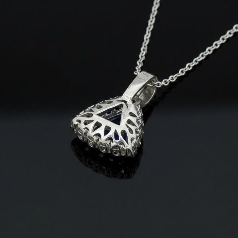 Dyach Necklace, Round Brilliant Cut Diamond 1.15cttw, 1 Tanzanite Trillion Cut 4.04ct, 14K/18K White Gold 8.46g. All Weights Estimated.