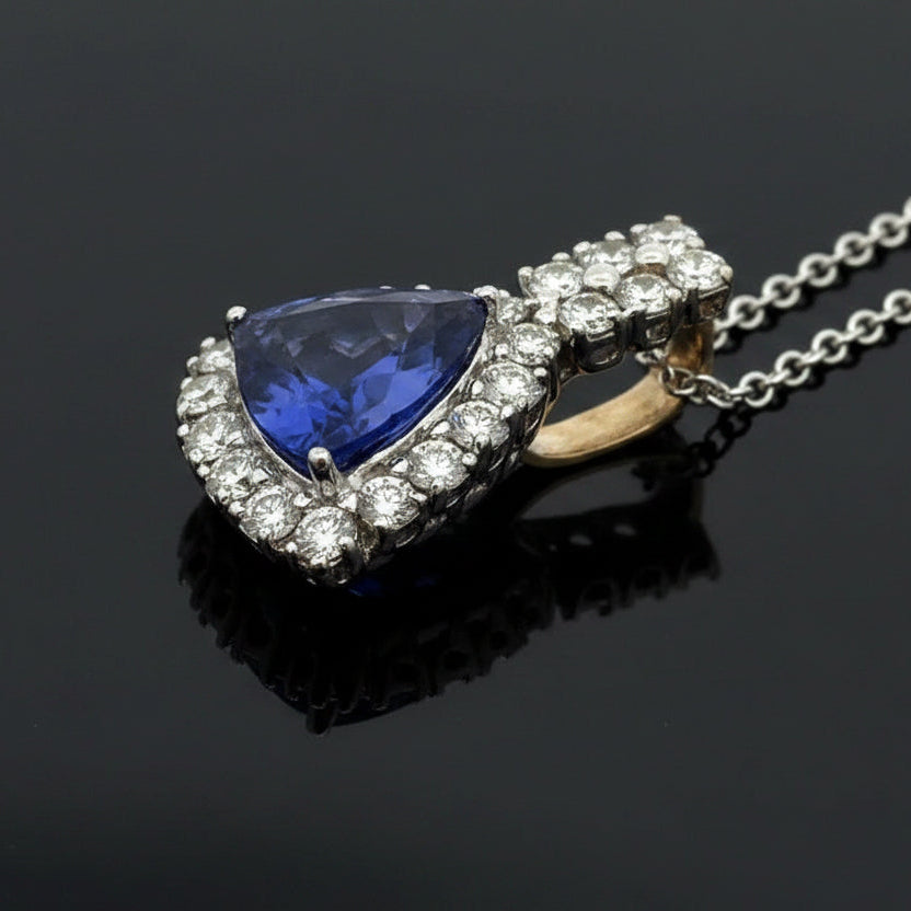 Dyach Necklace, Round Brilliant Cut Diamond 1.15cttw, 1 Tanzanite Trillion Cut 4.04ct, 14K/18K White Gold 8.46g. All Weights Estimated.