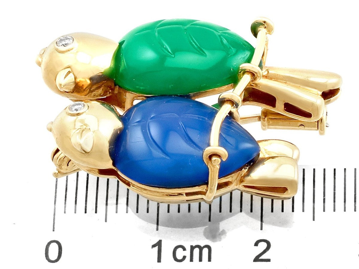 Cartier Paris Brooch/Pendant, 2 Round Brilliant Cut Diamonds 0.03cttw G-H VS1-VS2, Serial # B2934, 1 Chalcedony Carved Green, 1 Chalcedony Carved Blue, 18K Yellow Gold 10.30g, All Weights Estimated.