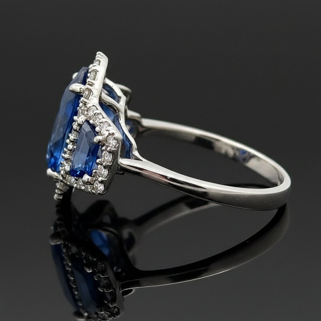 Estate Ring, 42 Round Brilliant Cut Diamond 0.75cttw G-H VS1-SI, 1 Sapphire Oval 6.03ct  GAL #202604712, 2 Sapphire Trapezoid Cut 1.05cttw, Platinum 7.95g. All Weights Estimated.