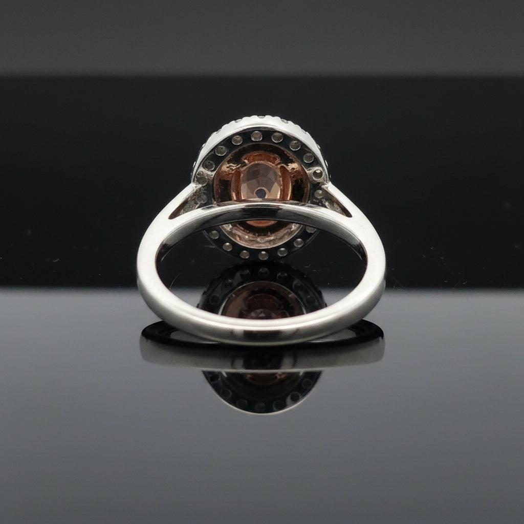 Estate Ring, 1 Oval Diamond .53ct  Fancy Purple-Pink I1 GIA #5182469614, 14 Round Brilliant Cut Diamond 0.12 cttw  Fancy Pink VS1-VS2, 20 Round Brilliant Cut Diamond G VS2-SI1 .20cttw. Platinum 6.63g. All Weights Estimated.