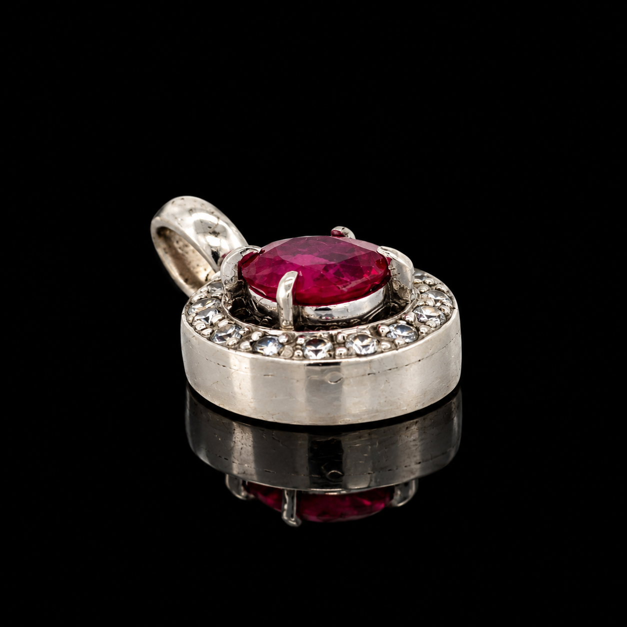 Estate Pendant, Round Brilliant Cut Diamond 0.18 cttw  G-H SI1-SI2,1 Ruby Oval 0.90 ct  Platinum 3.97g. All Weights Estimated.