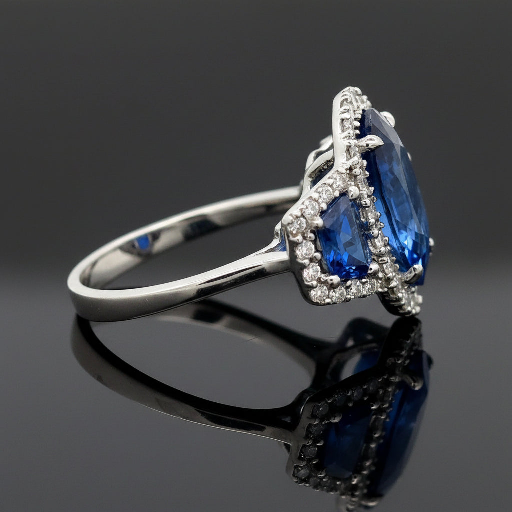 Estate Ring, 42 Round Brilliant Cut Diamond 0.75cttw G-H VS1-SI, 1 Sapphire Oval 6.03ct  GAL #202604712, 2 Sapphire Trapezoid Cut 1.05cttw, Platinum 7.95g. All Weights Estimated.