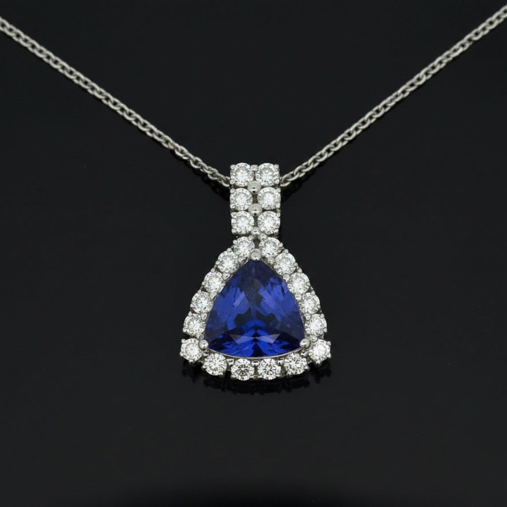 Dyach Necklace, Round Brilliant Cut Diamond 1.15cttw, 1 Tanzanite Trillion Cut 4.04ct, 14K/18K White Gold 8.46g. All Weights Estimated.